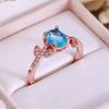 Evolvegem "Topziel Arbor" Oval Cut Blue Topaz Leaf Ring