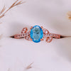 Evolvegem "Topziel Arbor" Oval Cut Blue Topaz Leaf Ring