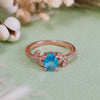 Evolvegem "Topziel Arbor" Oval Cut Blue Topaz Leaf Ring