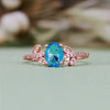 Evolvegem "Topziel Arbor" Oval Cut Blue Topaz Leaf Ring