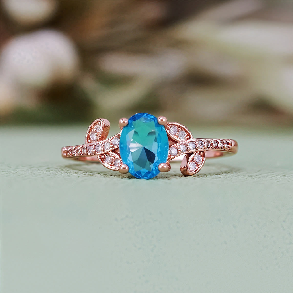 Evolvegem "Topziel Arbor" Oval Cut Blue Topaz Leaf Ring